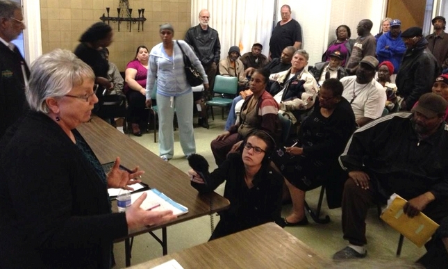Mayor Gayle McLaughlin addresses a throng of residents complaining about conditions at the Hacienda public housing projects in Richmond.